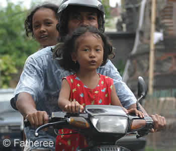 Family on Motorbike in Bali Family on Motorbike in Bali